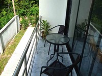 rental price studio apartment ZEN Balcony overlooking coconut plantation